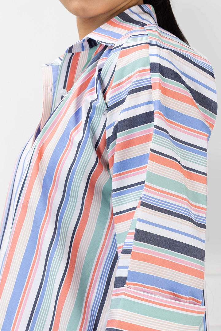 Close-up of a person wearing a multicolored striped shirt on a light gray background