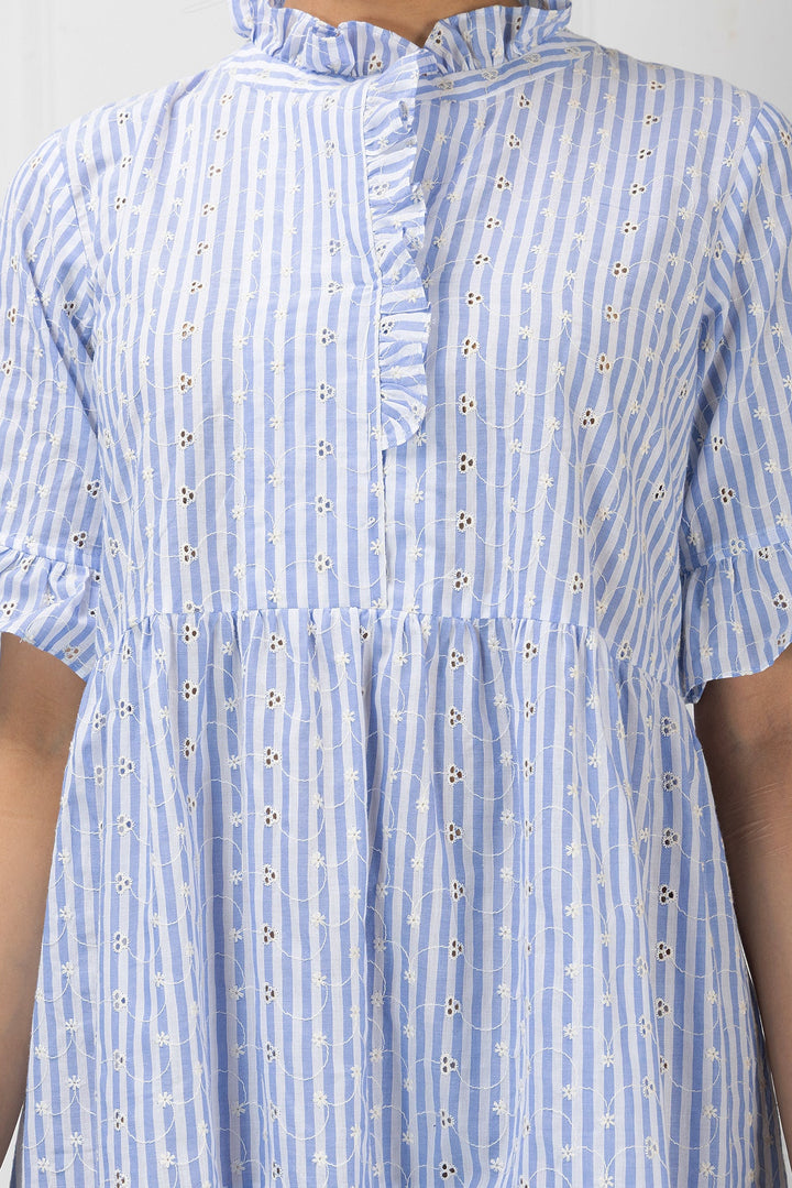 Blue and white striped dress with ruffled collar on a plain background