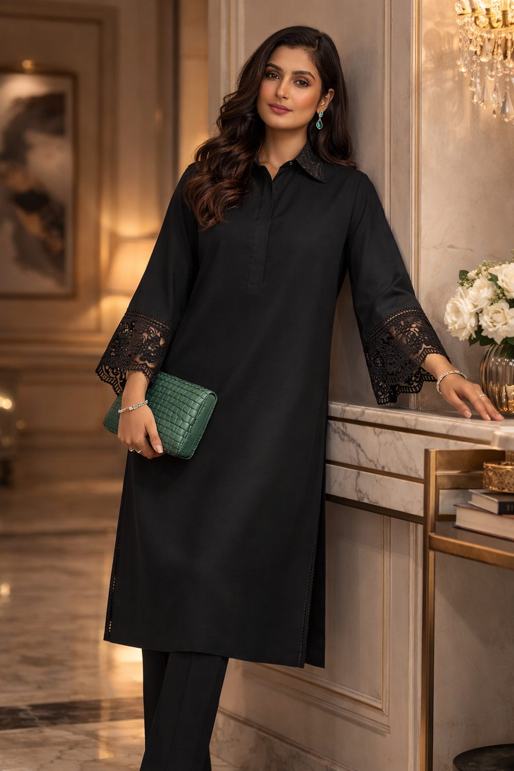 Woman in a black outfit holding a green clutch in an elegant interior setting.
