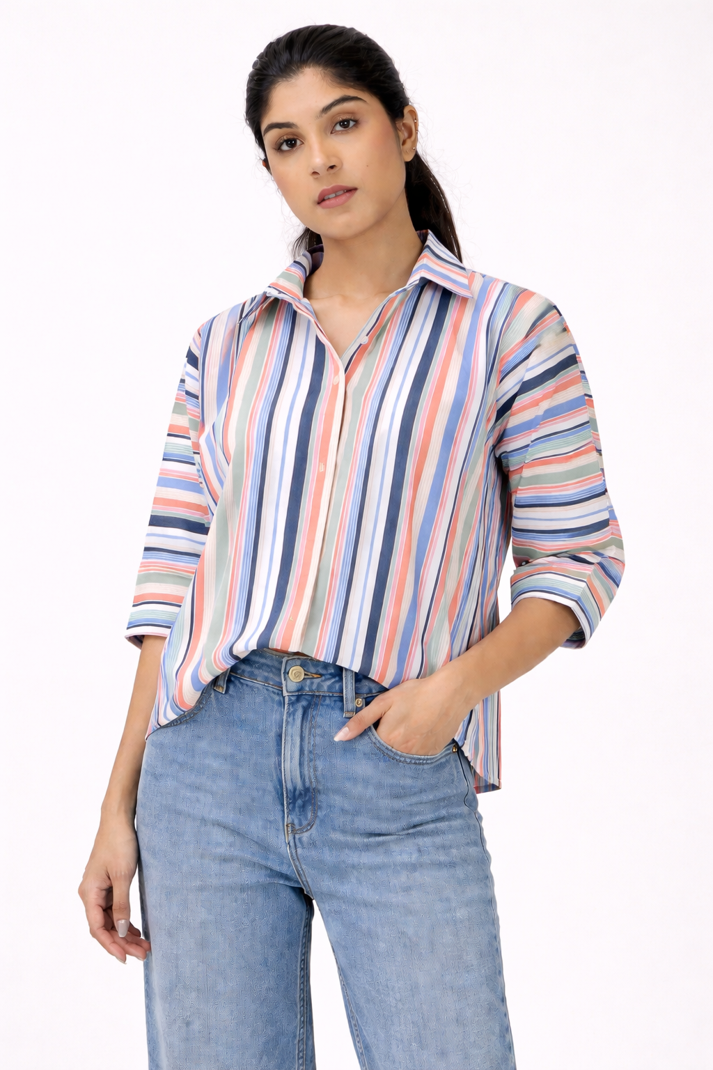 Woman wearing a striped shirt and jeans on a white background