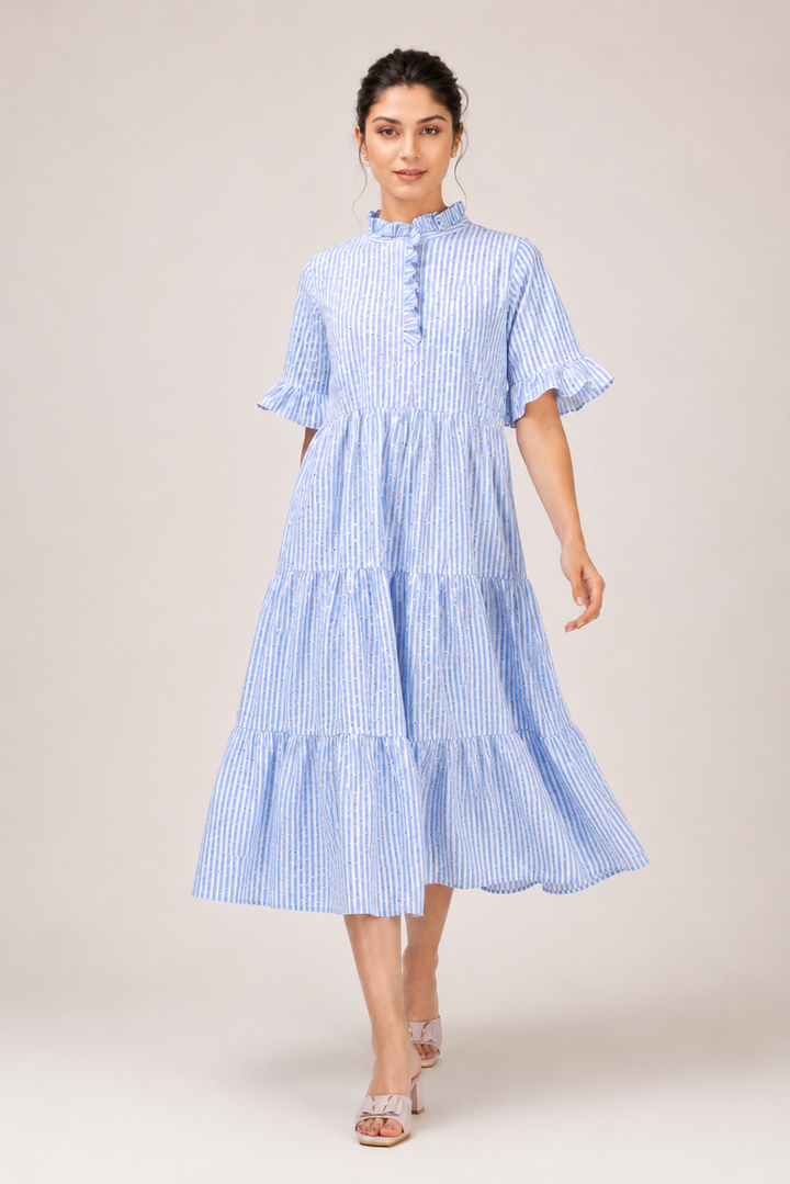 Woman wearing a blue and white striped dress on a beige background