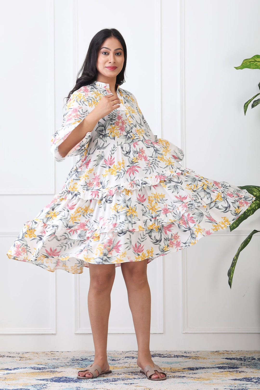 Woman wearing a floral dress with a white background