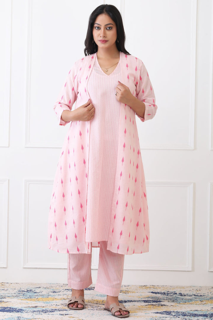 Woman wearing a pink traditional outfit with a white background
