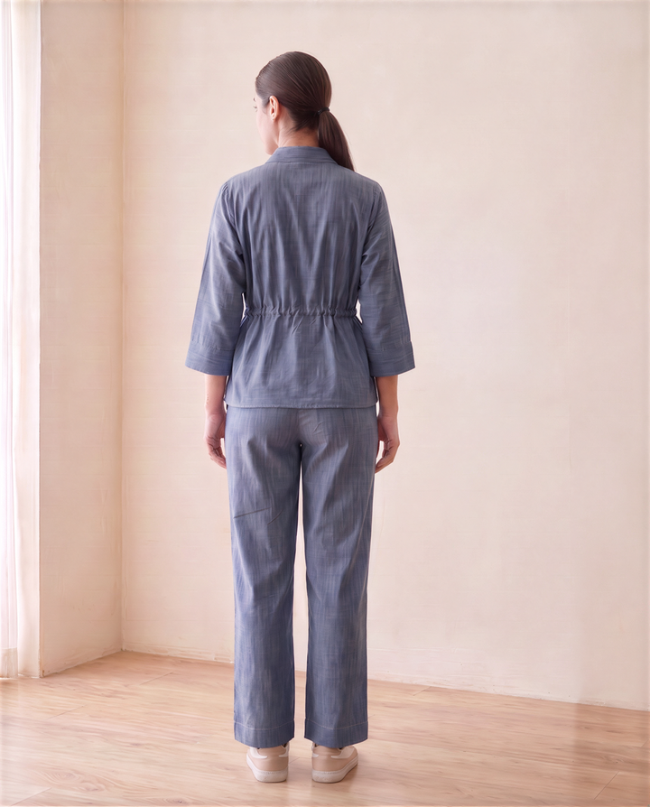Back view of the Alexis denim chambray co-ord set with gathered waist and wide-leg trousers
