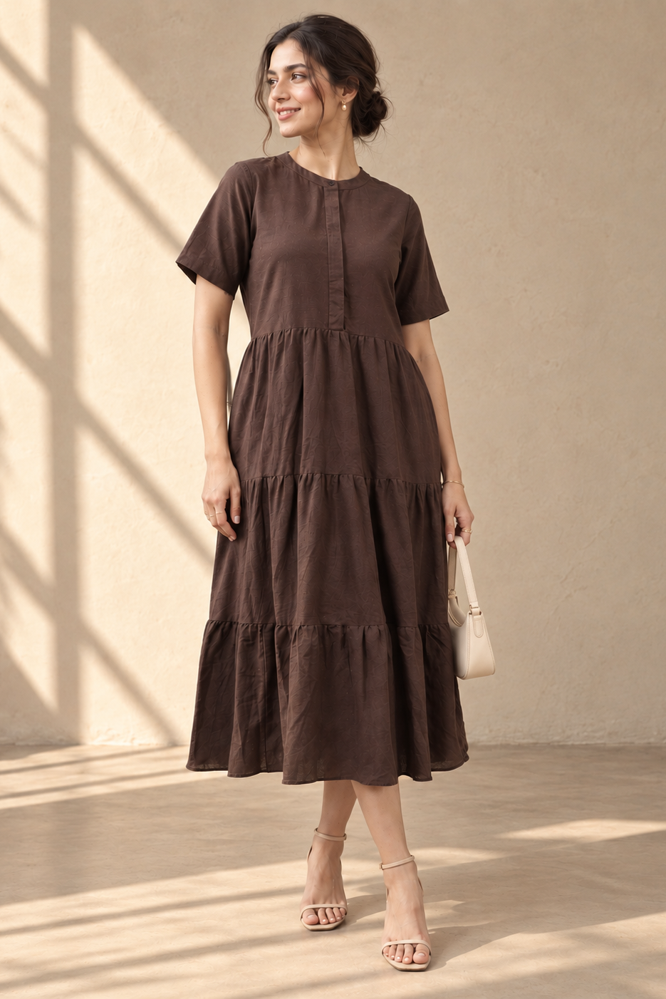 Woman wearing the Ines – Cotton-Linen Tiered Dress in Dark Brown, view 2